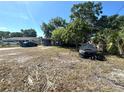 This single-story home has a driveway and mature trees at 620 Se Oleander Se Dr, Winter Haven, FL 33880