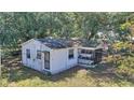 Aerial view of a single story home that features a screened front porch at 6925 3Rd St, Mulberry, FL 33860
