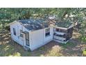 Aerial view of a single story home that features a screened front porch at 6925 3Rd St, Mulberry, FL 33860