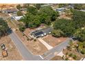 An overhead view of the residence showcasing its location, roof with solar panels, and surrounding neighborhood at 703 Osceola Ave, Lake Wales, FL 33853