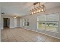 Open living area with tile floors, neutral walls, and an open layout perfect for entertaining at 703 Osceola Ave, Lake Wales, FL 33853