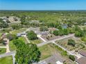 Expansive aerial view of the property set amidst lush greenery and serene surroundings at 9019 Oakwood Dr, Lake Wales, FL 33898