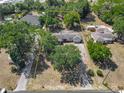 Aerial shot showcasing the property's layout and expansive lot size enclosed by a yellow border at 1024 Campbell Ave, Lake Wales, FL 33853