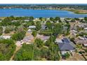 Aerial view of the property highlighting its proximity to a large, scenic lake and surrounding neighborhood at 1024 Campbell Ave, Lake Wales, FL 33853