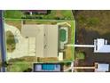 Aerial shot highlighting the property's lot, pool, waterfront access, and proximity to the lake at 108 Lake Howard Dr Nw, Winter Haven, FL 33880