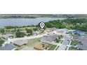 Panoramic aerial view of the property showcasing its location near a serene lake and neighborhood at 147 Brookshire Dr, Lake Wales, FL 33898
