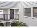 Exterior shot of the unit E7 front door, balcony, and front window at 1550 11Th Ne St # E7, Winter Haven, FL 33881