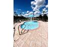 Splash pool with a fountain and surrounding deck, perfect for Gathering fun at 1820 Coriander Dr, Poinciana, FL 34759