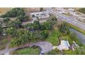 Aerial view of property and surrounding neighborhood featuring mature trees and landscaping at 230 Denton Ave, Auburndale, FL 33823