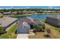 A tranquil view overlooking the backyard with lake access of this property in a beautiful neighborhood at 3374 Waterlute Way, Lakeland, FL 33811