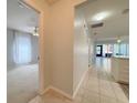 Bright hallway with tiled floor and open view to living room and a room with carpet at 4480 Turnberry Ln, Lake Wales, FL 33859