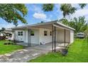 Features an inviting exterior with an open carport for convenient parking at 4760 Holton Rd, Auburndale, FL 33823
