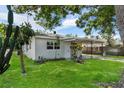 Charming home with a lush green lawn and carport at 4760 Holton Rd, Auburndale, FL 33823