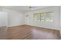 Bright living room featuring modern flooring and a sunlit window at 5829 Lake Breeze Ave, Lakeland, FL 33809
