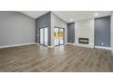 Open living room with fireplace and a seamless flow to the outdoors at 6014 Crystal View Dr, Orlando, FL 32819