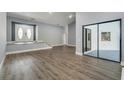 Bright and airy living room with vaulted ceilings and seamless flooring at 6014 Crystal View Dr, Orlando, FL 32819