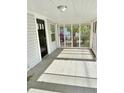 Screened-in front porch with tile flooring at 602 Nw 1St Ave, Mulberry, FL 33860