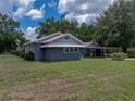 Charming home with well-manicured front lawn, covered parking, and a fenced backyard at 803 7Th Ne St, Fort Meade, FL 33841