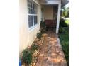 Cozy front porch features decorative tile, stone accents, and inviting seating area at 808 Ware Ne Ave, Winter Haven, FL 33881