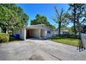 Charming single-story home featuring a convenient carport and ample parking at 825 Augusta St, Lakeland, FL 33805