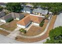 Aerial view of a single-story home in a residential neighborhood at 1055 Sunshine Sw Way, Winter Haven, FL 33880