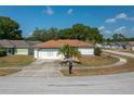 Charming single-story home with a well-maintained lawn and a two-car garage at 1055 Sunshine Sw Way, Winter Haven, FL 33880