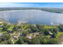 An aerial view of the property and its beautiful surroundings with lake access at 1163 Lake Dr, Lake Wales, FL 33859