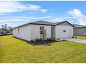 Lovely single-Gathering home with a landscaped yard and a two-car garage at 1752 Forest Run Ln, Auburndale, FL 33823