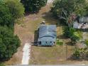 Aerial view of home showcasing its cozy layout, surrounding trees and large lot at 1949 Old Bartow Rd, Lake Wales, FL 33859