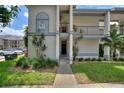 Condo entrance with well-maintained landscaping and visible signage at 2180 San Marcos Se Cir # 401, Winter Haven, FL 33880