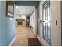 Inviting foyer with tile floors, decorative front door, and a view of the living room fireplace at 250 Brigham Nw Rd, Winter Haven, FL 33881
