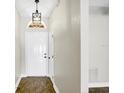 Bright foyer featuring tile flooring, fresh white walls, and a classic light fixture at 251 Kings Pond Ave, Winter Haven, FL 33880