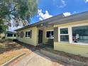 The home's exterior has a simple design and a small landscaped area near the entryway at 3022 Hickory Nw St, Winter Haven, FL 33881