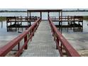 Waterfront dock featuring covered seating area with great lake views at 333 Lake Howard Nw Dr # 103C, Winter Haven, FL 33880