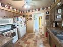 Functional kitchen with vintage accents, good cabinet space, and easy access to other rooms at 426 Gleneagles Ct, Winter Haven, FL 33884