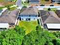 Aerial view of the backyard with a lush lawn at 476 Haines Trl, Winter Haven, FL 33881