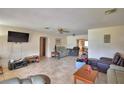 Spacious living room featuring tile flooring, ceiling fan, and open floorplan at 780 Oleander Se Dr, Winter Haven, FL 33880