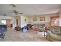 Bright and airy living room with tile flooring and plenty of seating space at 780 Oleander Se Dr, Winter Haven, FL 33880