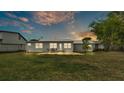 Spacious backyard featuring a patio area perfect for outdoor gatherings and entertaining at 900 Lake Jessie Dr, Winter Haven, FL 33881
