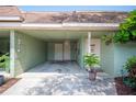 Carport view showcasing ample parking, exterior door, and decorative details at 2202 Starboard, Winter Haven, FL 33881