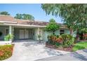 Charming exterior of home showcasing covered parking and beautifully landscaped grounds at 2202 Starboard, Winter Haven, FL 33881