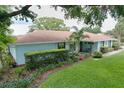 Beautiful one-story home boasts lush green grass and landscaping at 255 Lake Link Rd, Winter Haven, FL 33884