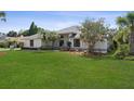 Lush front yard with a well-maintained lawn and inviting exterior at 2987 Plantation Rd, Winter Haven, FL 33884