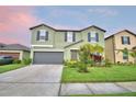 Charming two-story home with a well-maintained lawn, garden and two-car garage at 4400 Trotters Way, Lakeland, FL 33801