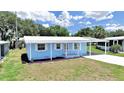 Charming single-story home with a carport and well-maintained front yard at 4859 Foxwood Blvd, Lakeland, FL 33810