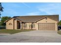 Charming single-Gathering home with a two-car garage, manicured lawn and inviting curb appeal at 505 8Th S St, Dundee, FL 33838