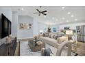 Stylish living room featuring modern furniture and an open floor plan at 648 Lorient Dr, Eagle Lake, FL 33839
