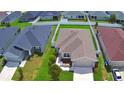 Aerial view of a single-story home with fenced yard, surrounded by lush green lawns at 879 Orleans Dr, Eagle Lake, FL 33839