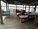 Cozy covered dock with ample seating and views of the water at 9402 Cat Track Trl, Lake Wales, FL 33898