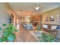 Inviting living room flows into kitchen with a large island and open floor plan at 1100 Sugarwood St, Davenport, FL 33837